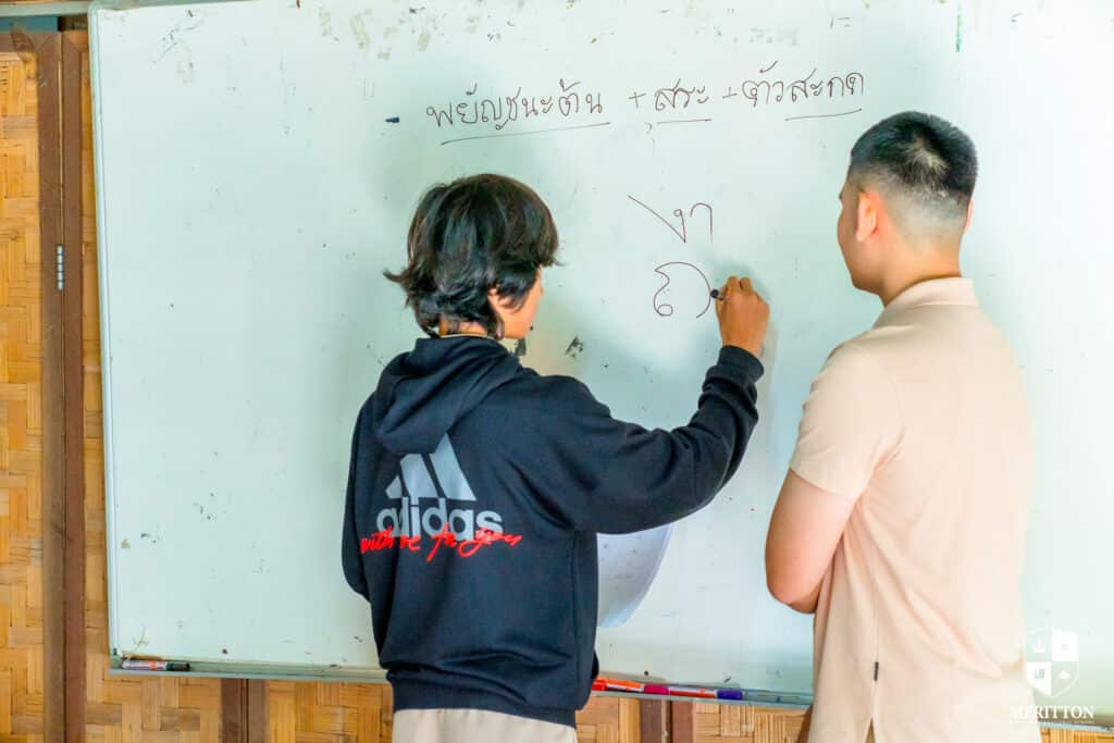 Student Learning Lanna Script